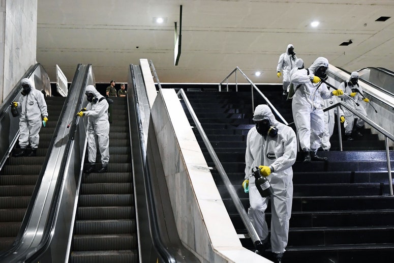 sanitation workers cleaning stairs