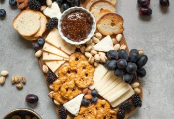 baked breads and cookies on brown wooden board