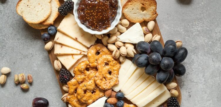 baked breads and cookies on brown wooden board