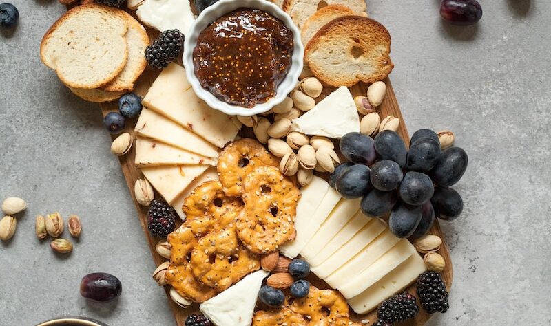 baked breads and cookies on brown wooden board